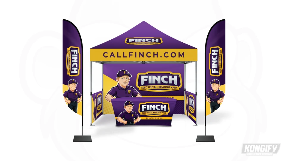 Finch event display with purple-and-gold canopy, flags, backdrop, table cover, name badges, and technician character.