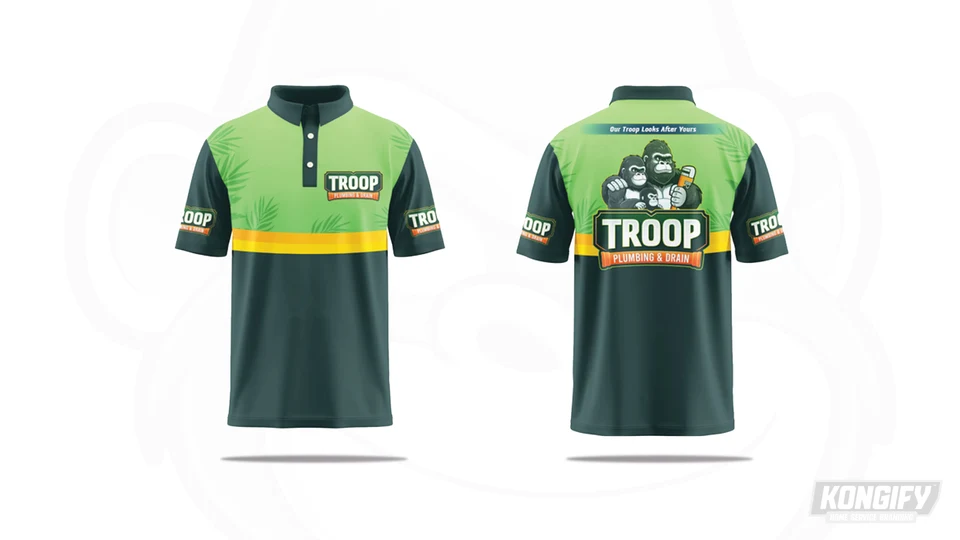 Troop polo design with light green leaf patterns, dark green sleeves and lower body, a yellow band, and a gorilla-group logo on the back.