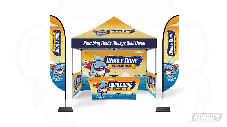 Whale Done event display with an ocean backdrop, whale mascot, and matching table cover.